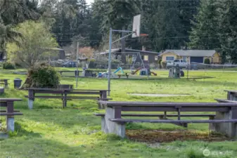 Lynch Cove Beach front park- picnic tables and playground with basketball half court