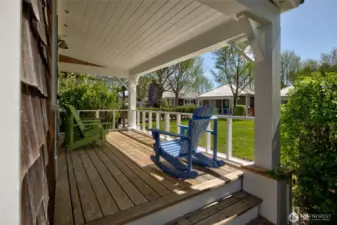 The south facing covered porch offers a quiet space to listen to the birds and ocean.