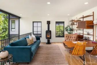 A stylish loft features an original 1950s Danish wall unit by Poul Cadovius and a sculptural Danish fireplace.