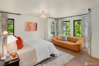 The generous 3 secondary bedrooms can be separated from the primary suite by a pocket door divider to create two private wings, ideal for guests or family.