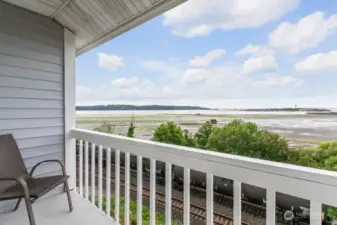 Step outside the main level covered deck, where you can relax and watch the birds drift by as you soak up the fresh sea air.
