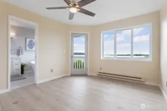 The fully remodeled primary bedroom is fresh, bright, and inviting.  Tastefully designed to start and end your day in comfort. Step outside onto your private deck and enjoy morning coffee, soak in the sun, or enjoy quiet evenings watching the sun set.