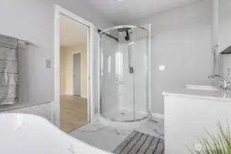 The fully remodeled primary bathroom is fresh, bright, and inviting.  Tastefully designed to start and end your day in comfort.