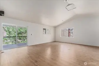 Living room with sliding glass doors to the covered deck.