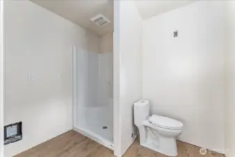 Bathroom with walk-in shower.