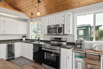 You love the extras this kitchen offers with a wine fridge and coffee bar!