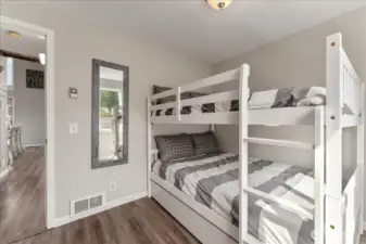 Main floor 2nd bedroom with full size double. beds.