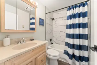 Lower level full bath with tub and shower right off garage  - perfect for coming in after a day on the water!