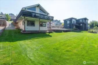 .20 acre lot includes lush green lawn area for yard games and entertaining.
