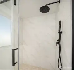 Large walk-in shower in the primary suite