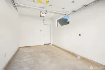 Single car garage with 220 outlet for electric car charging.