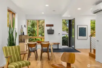 Elegant design draws your eyes to cherished artwork while the changing seasons delight outside.