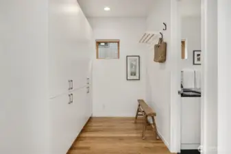 With deep built-in storage, the open dressing room design flows into the primary en suite bathroom.