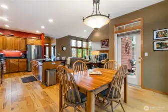 Dining and kitchen area with door leading to back deck.