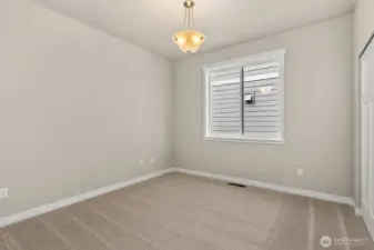 2nd bedroom/ Adjacent to full bathroom is the second bedroom featuring a large reach-in closet.