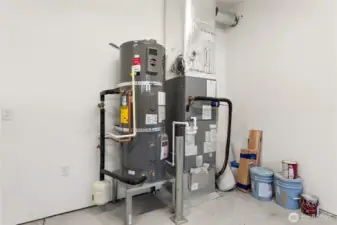 High efficiency Carrier electric forced-air furnace and Electric hybrid water heater.