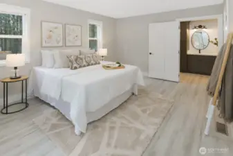 Primary bedroom with en-suite bath attached and french doors out to front patio