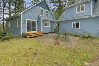 Backyard looking at main home, garage, and ADU