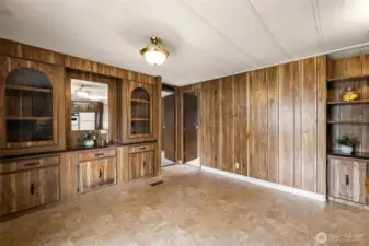 Dining room has built in cabinets and shelves too