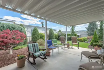 How about this gracious covered patio for year-round enjoyment?