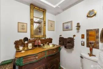 The lighthouse bathroom is stunning with its antique vanity.