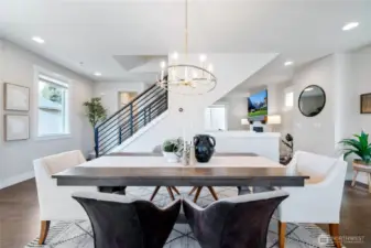 The well-appointed dining with a designer chandelier.