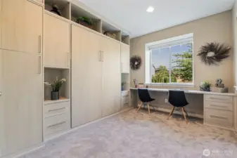 Main floor office/bedroom combo with Murphy bed, built-in desk, and California Closet.