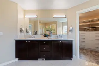 Dual sinks and plenty of cabinets and drawers to store your personal items.