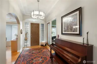 High ceiling entry with updated light fixture.  Office entry (shown to the right)