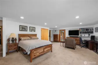 Primary bedroom on lower level with walkout french doors to the deck.