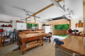 Shop with garage door for boat or golf cart parking.