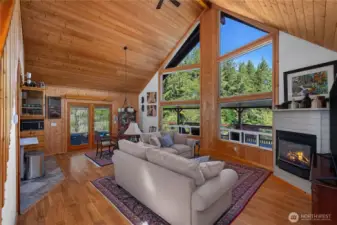 Vaulted ceilings and wall to ceiling windows.