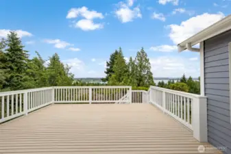 Enjoy panoramic views from this oversized deck ideal for hosting gatherings or simply soaking in the peaceful surroundings. A true extension of the indoor living space.