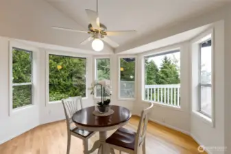 Nestled into a bay window alcove, this charming breakfast nook is the perfect place to start your day. Surrounded by trees, it feels like your own personal treehouse retreat.