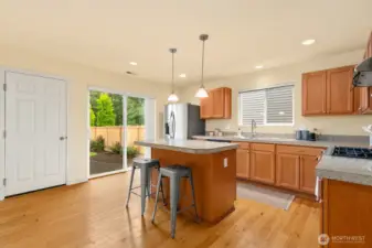 Garage entry into kitchen, and slider opens to the back yard.