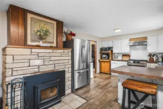 New wood stove insert in fireplace located between kitchen and dining room.  Perfect cozy spot!