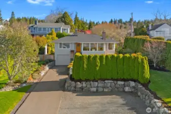 Set far off the street with large driveway and room to turn around + one car garage
