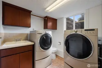 Downstairs laundry also is a half bath