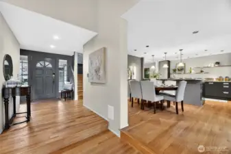 Open-concept layout with hardwood floors, spacious dining area & updated kitchen. Bright, flowing design ideal for entertaining & everyday living.