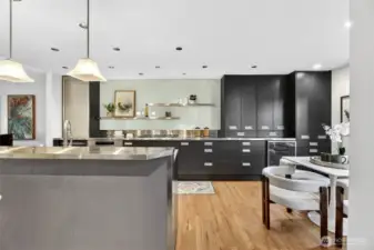 Updated kitchen with sleek cabinetry, large island & stainless steel chefs kitchen. Open layout, ample storage & modern finishes create a stylish, functional space.