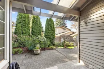 Spacious rear yard retreat just off the dining room, featuring a partially covered patio & lush, mature landscaping. Ideal for outdoor dining, relaxing or year-round enjoyment.