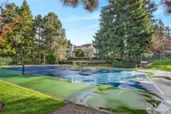 Community sport court with dedicated tennis & pickleball lines, offering great space for recreation & staying active just steps from home.