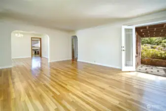 Coved ceilings and real hardwood flooring on main level. Living room with french doors leading to private custom patio.