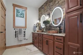 Primary Bath comes with heated floors, heated towel bars, and lighted mirrors.