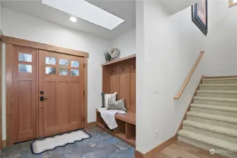 Main door with slate floors entrance and nook.