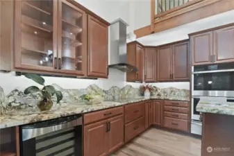 Kitchen includes wine fridge, double ovens and microwave.