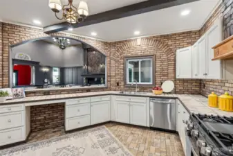 A great view of the living room and window to keep an eye on backyard happenings! Under the counters, find a handy spot for a stool, extra storage, trash bin, or a perfect spot for a pet nook!