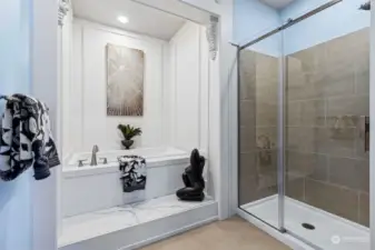 Step into the double size tile and glass shower, or opt for a spa moment in the deep soaking tub, ready to melt away the cares of the day in this primary suite bathroom.