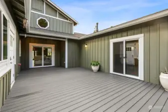 Step onto the patio, where you’ll find sliders to the living room and primary suite, plus a door to the pool right across the way. Trex decking gives added peace of mind for many years of maintenance free durability!