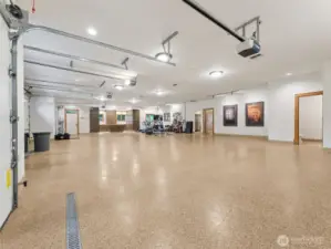 2,909 sq ft finished garage. Includes a large closet, a kennel for your dogs with auto-fill water bowls, hose hook-up for easy clean ups, a half bathroom, built-in cabinetry and an office or storage room.